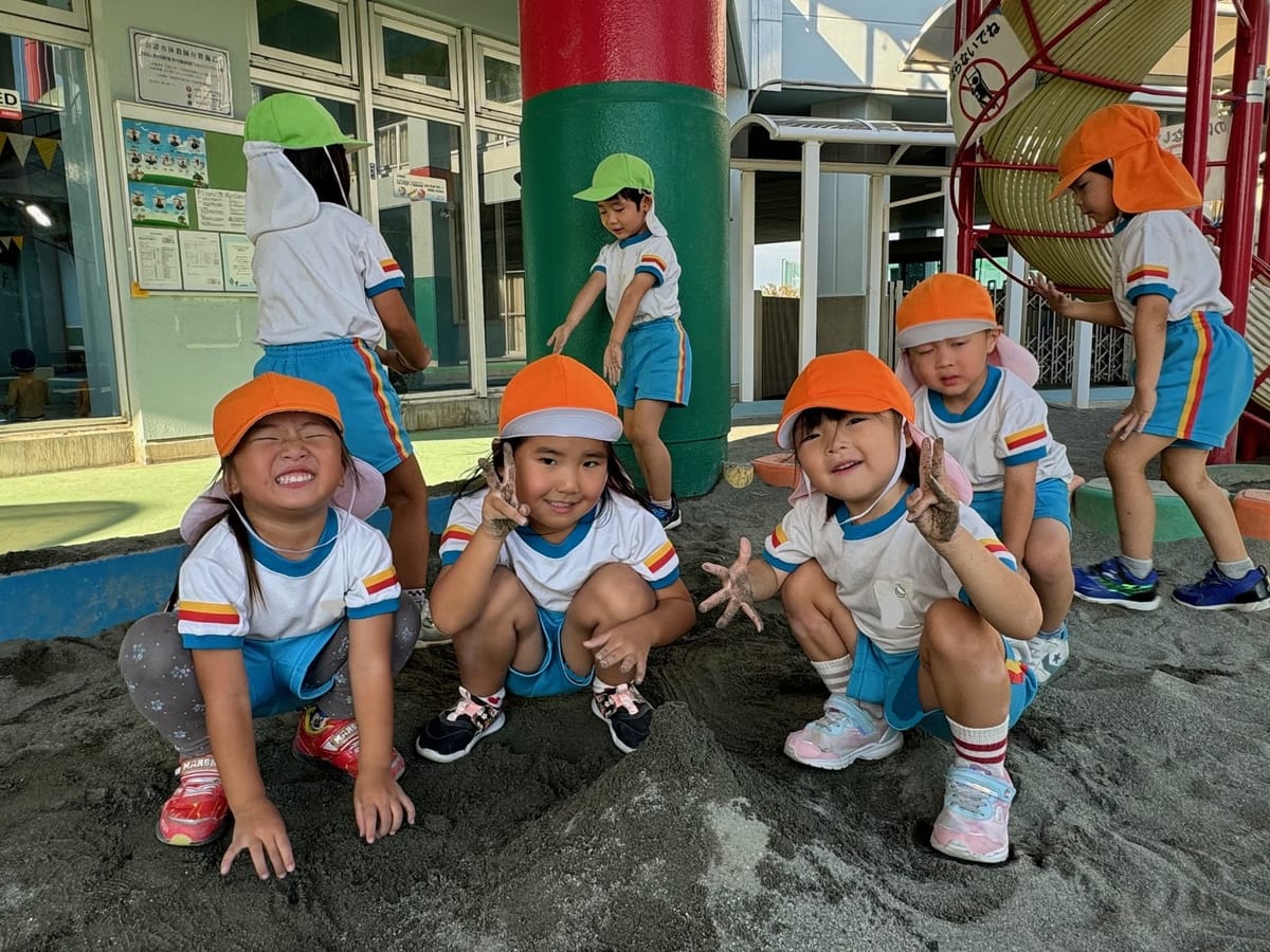 Children in extended care playing in the sandpit