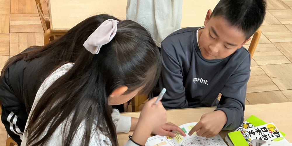 Children doing their school homework at the after-school club