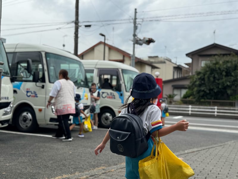 A child walking to the school bus