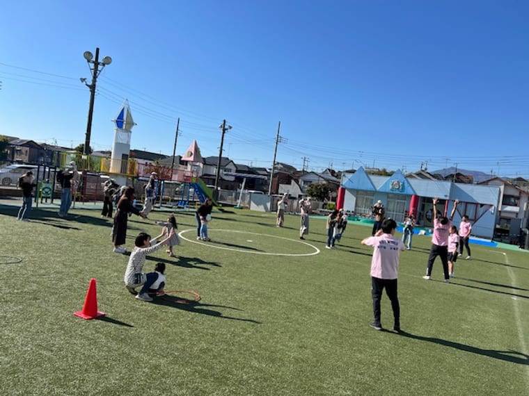 Parents and children exercising together in the playground at KIDS WORLD